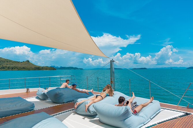 Luxury Boat to James Bond Islands with Lunch and Sunset Dinner - The Boat Life: DJ, Wi‑Fi, Water Slide, and Shade