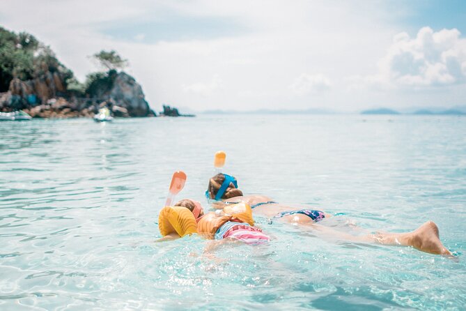 Private Boat Tour with Dolphin Spotting and Snorkelling from Phuket - Coral Island: Clear-Water Snorkel Time and a Beachy Reset